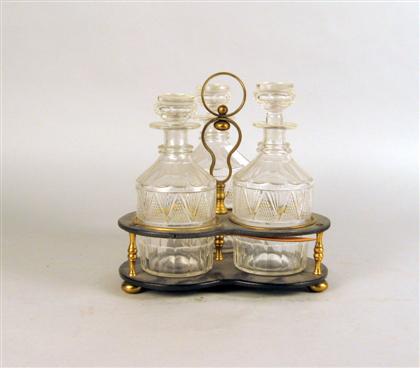 Appraisal: Tri-form tantalus With three cut glass decanters H in