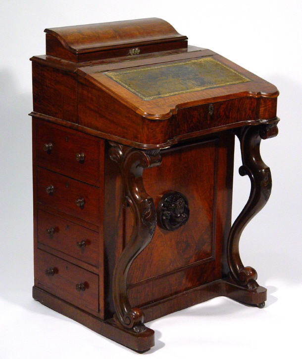 Appraisal: Victorian walnut Davenport fitted a letter rack with hinged lid