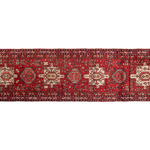 Appraisal: Two Persian Wool Rugs th Century comprising a Caucasian runner