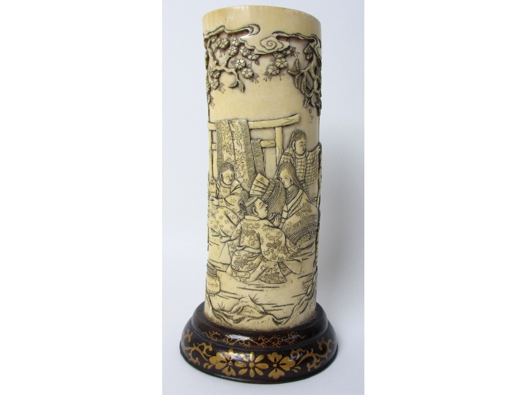 Appraisal: A Japanese carved ivory tusk continuously carved with numerous figures