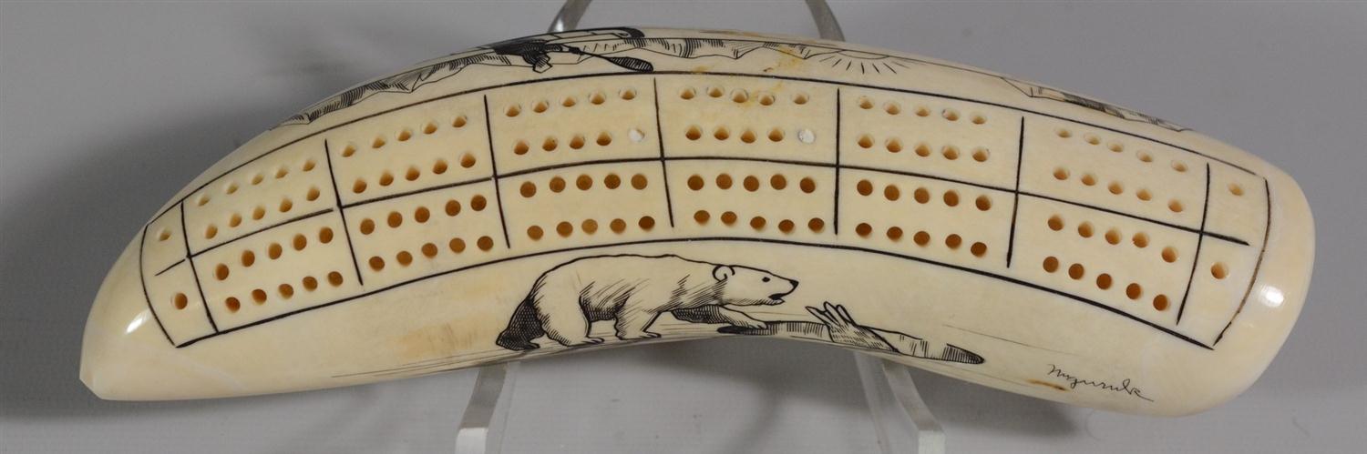 Appraisal: Scrimshawed walrus tusk cribbage board scene of figure in kayak