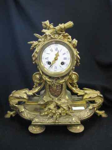 Appraisal: French Bronze Clock birds and bow design hoof feet leaf