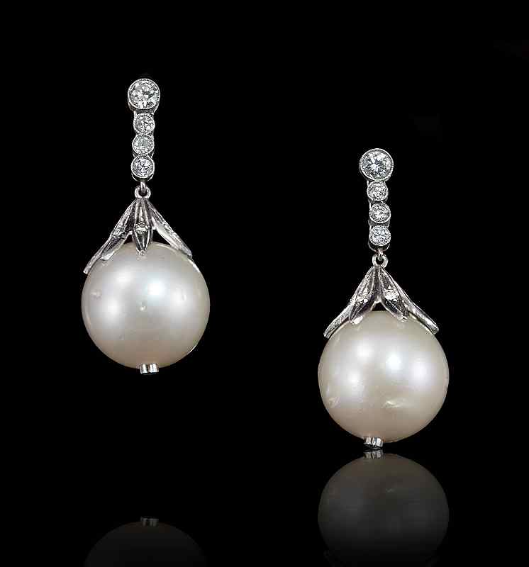 Appraisal: PLATINUM SOUTH SEA PEARL AND DIAMOND EARRINGS Pearls at the