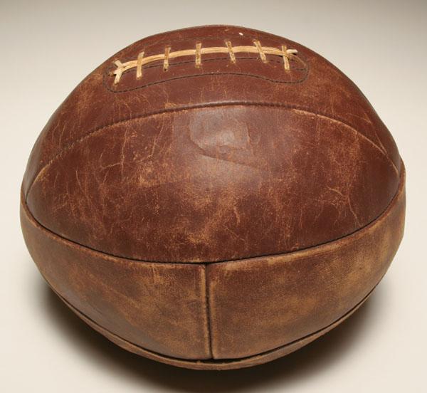 Appraisal: Leather medicine ball with rawhide stiching W