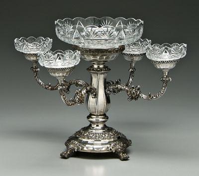 Appraisal: Silver plate epergne four scrolled arms paw feet cut glass