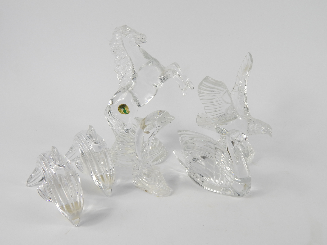 Appraisal: Waterford Crystal sculptures comprising an eagle rearing horse three dolphins