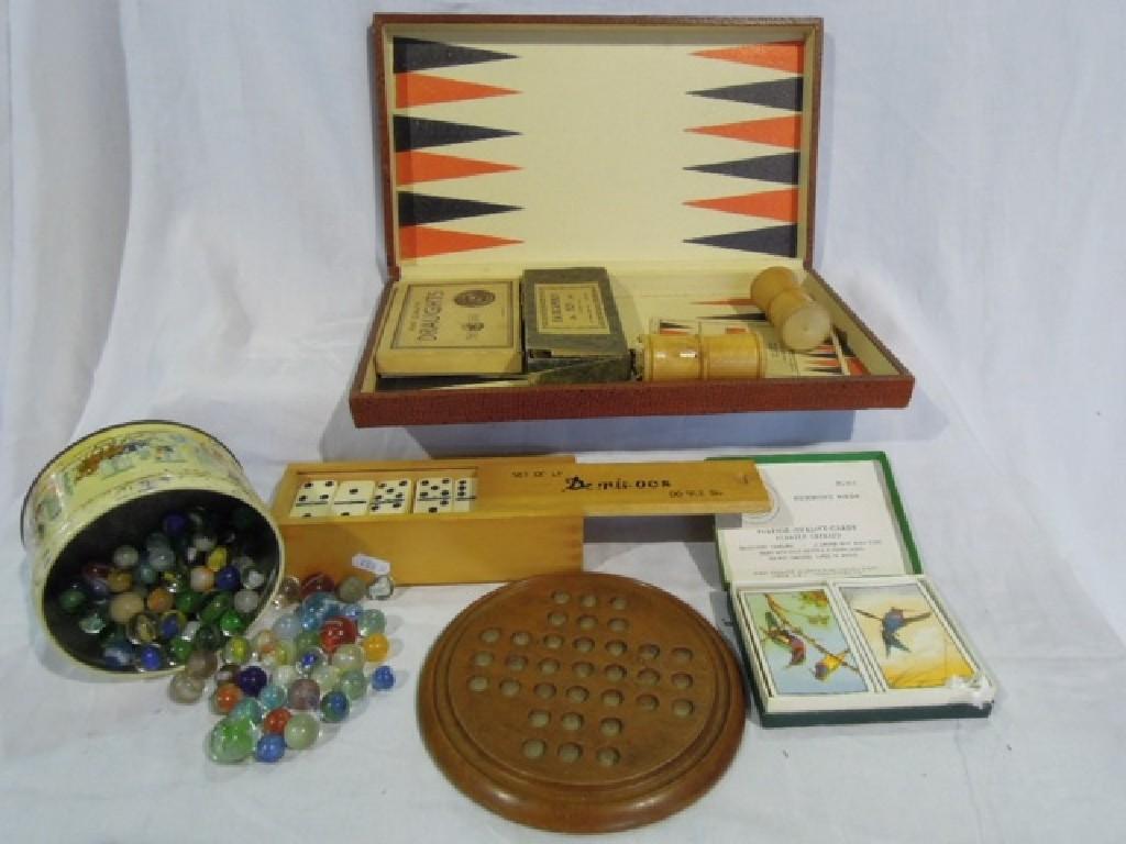 Appraisal: A backgammon set complete with counters and a set of