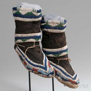 Appraisal: Ute Beaded Cloth and Hide Moccasins c with thick buffalo