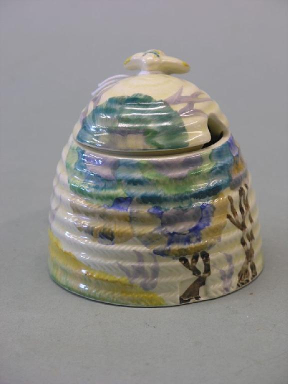 Appraisal: A Clarice Cliff honey pot Rhodanthe - type pattern predominantly