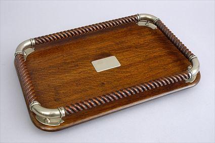 Appraisal: EDWARDIAN BRASS-MOUNTED OAK TRAY The rope-twist galleried surface with rounded