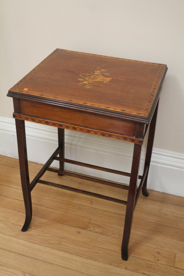 Appraisal: A late Victorian marquetry occasional table with floral basket inlaid