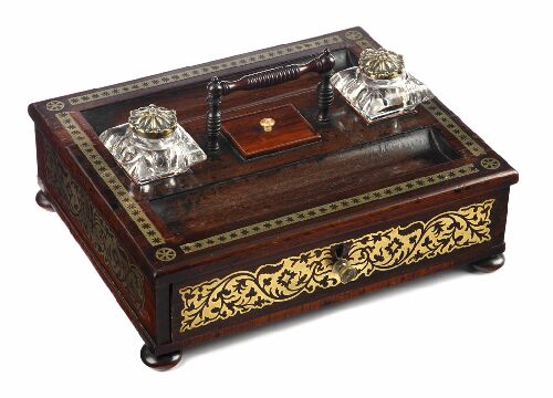 Appraisal: A Regency rosewood and brass inlaid desk stand the rectangular