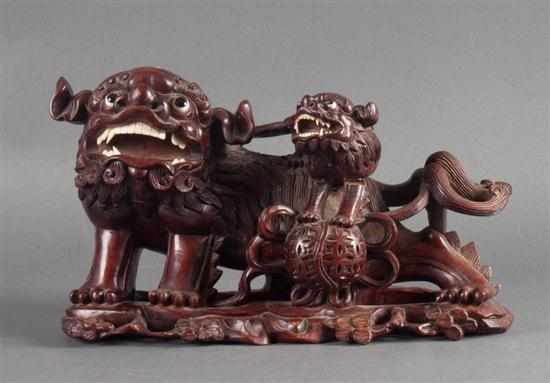 Appraisal: Chinese carved hardwood foo dog and pup th century with