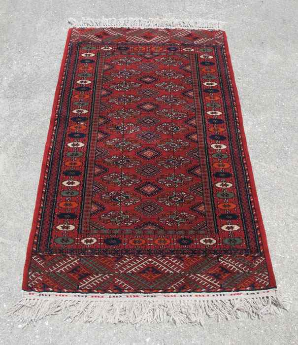 Appraisal: MODERN PAKISTANI BOKHARA HAND KNOTTED WOOL RUG ' '' x