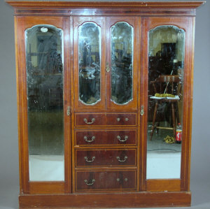 Appraisal: An Edwardian inlaid triple wardrobe the dentil cornice above central