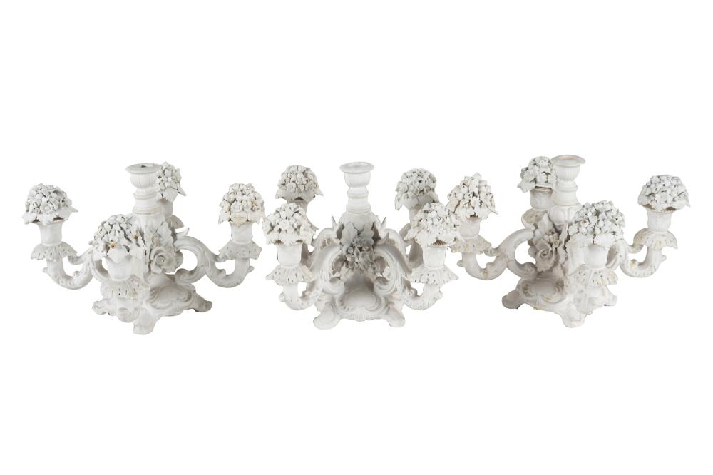 Appraisal: THREE ITALIAN BISQUE PORCELAIN CANDELABRA th century each marked to