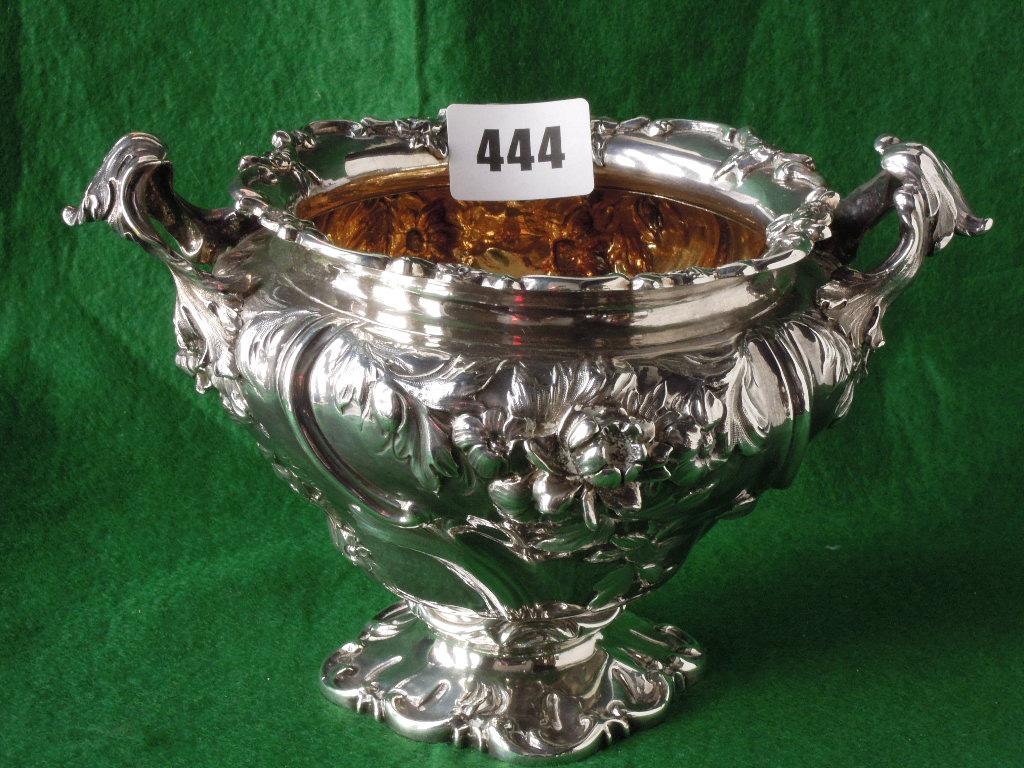 Appraisal: A silver sugar bowl heavily embossed with floral detail London