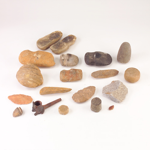 Appraisal: Seventeen Native American artifacts to include grinding stones pipe arrowheads