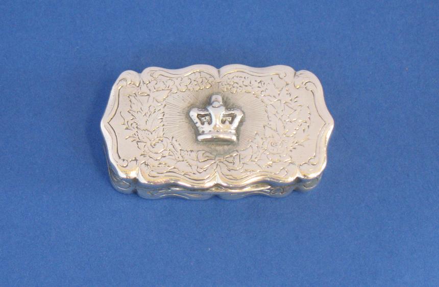 Appraisal: A VICTORIAN VINAIGRETTE of shaped rectangular form the cover engraved