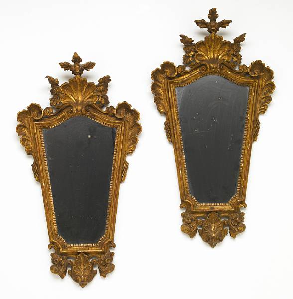 Appraisal: A pair of Italian Rococo style giltwood mirrors fourth quarter