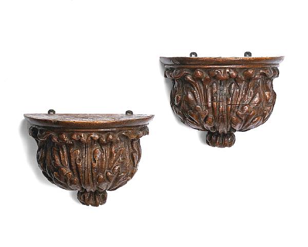 Appraisal: A pair of Louis XIV carved walnut brackets early th