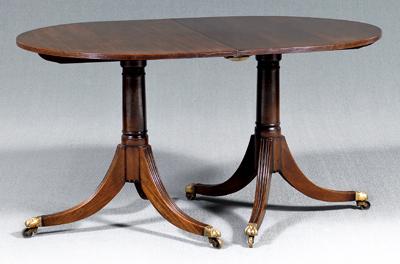 Appraisal: Regency style dining table each of two pedestals with D