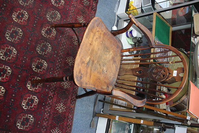 Appraisal: A TH CENTURY YEW AND ELM WINDSOR WHEELBACK ARMCHAIR half