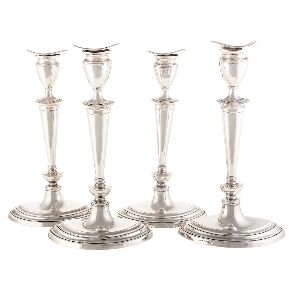 Appraisal: Four Elizabeth II Sterling Candlesticks T Co Sheffield stepped lozenge