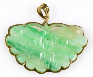 Appraisal: Carved jadeite and k yellow gold pendant Carved jadeite and