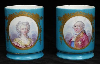 Appraisal: PAIR OF SEVRES PORCELAIN CYLINDRICAL PORTRAIT VASES Underglaze blue interlaced