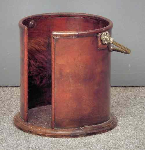 Appraisal: A Victorian mahogany cylindrical plate bucket with brass folding bale