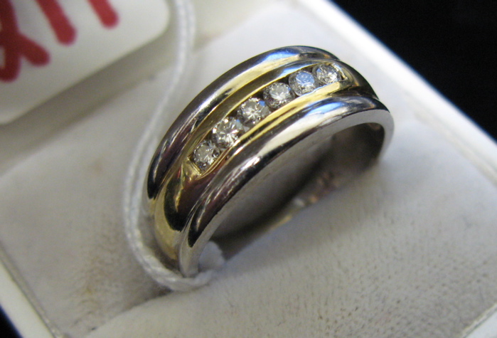 Appraisal: MAN'S DIAMOND AND FOURTEEN KARAT WHITE AND YELLOW GOLD RING