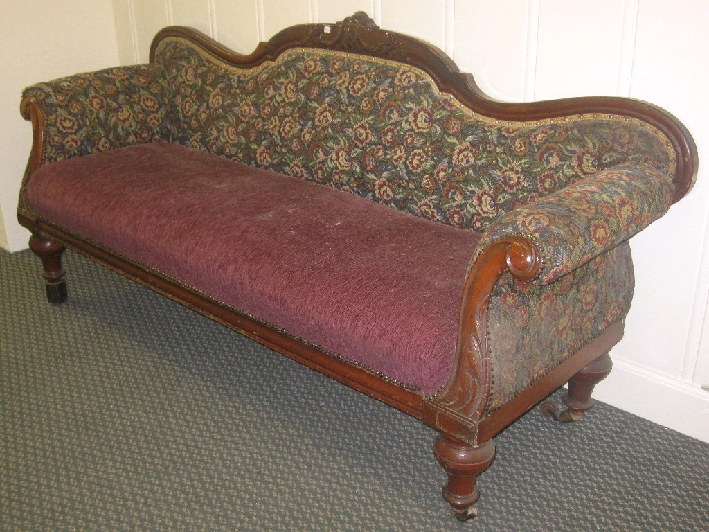 Appraisal: Victorian mahogany framed settee missing two castors