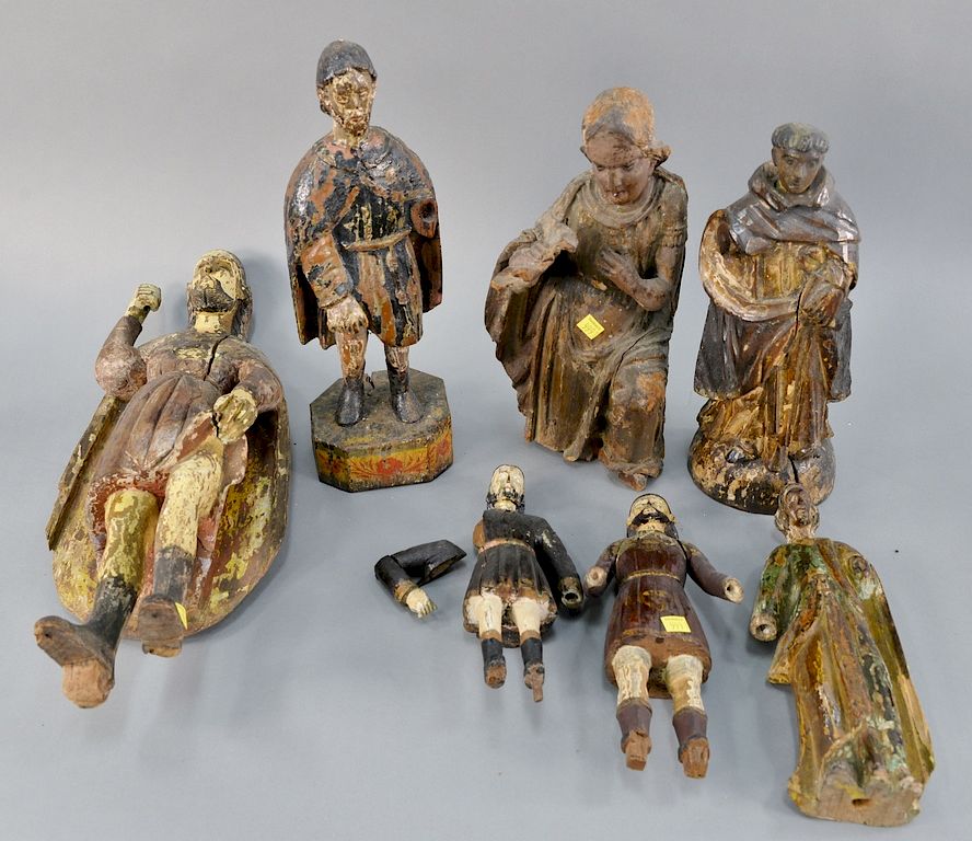 Appraisal: Seven carved Continental figures of polychromed men ht in to