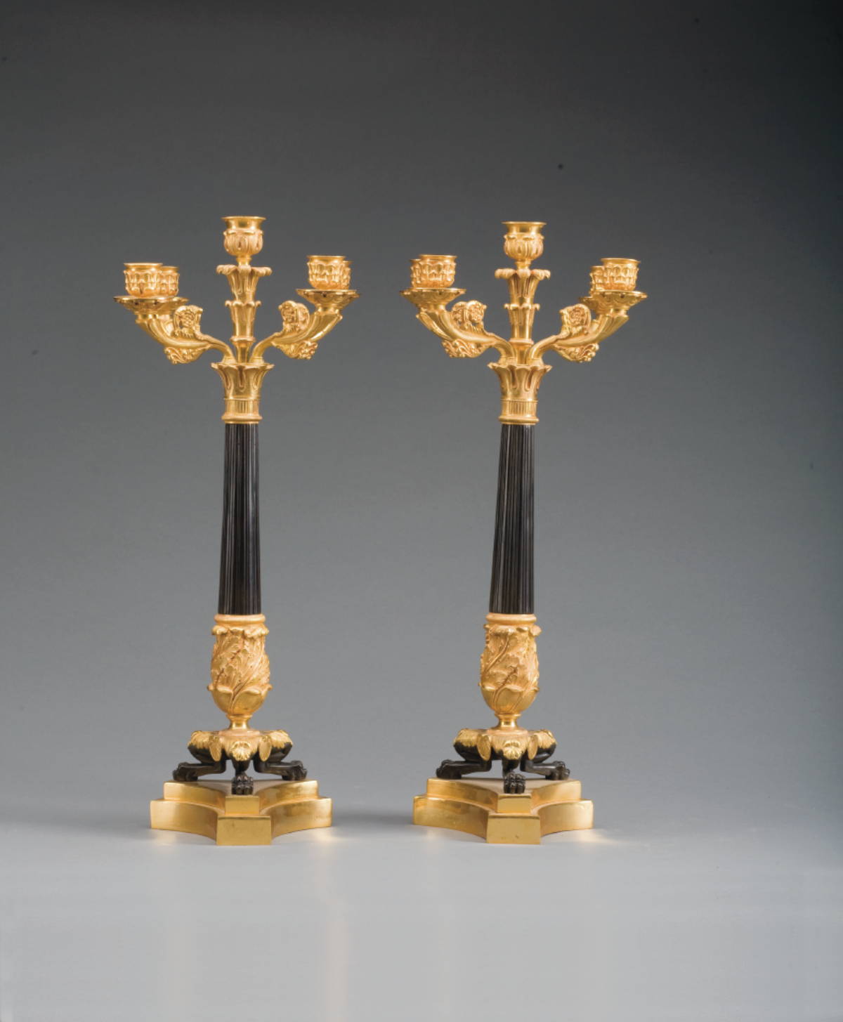 Appraisal: PAIR OF CHARLES X STYLE PATINATED AND GILT-METAL FIVE-LIGHT CANDELABRA