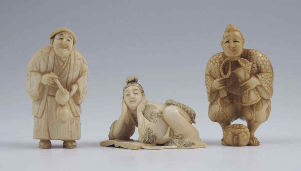 Appraisal: JAPANESE CARVED IVORY NETSUKE To include Clown figure with fan