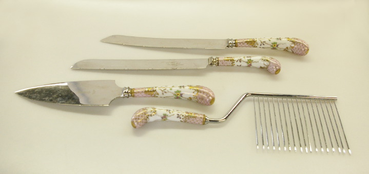 Appraisal: Four-Piece German Pistol-Handled Porcelain and Stainless Steel Bread and Pastry-Serving