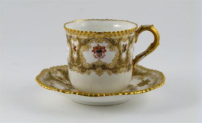 Appraisal: A Royal Worcester armorial cup and saucer decorated with gilded