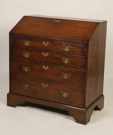 Appraisal: A GEORGE II OAK BUREAU the sloping fall enclosing six