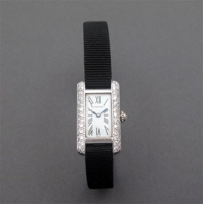 Appraisal: An ct white gold tank wristwatch by Cartier white enamel