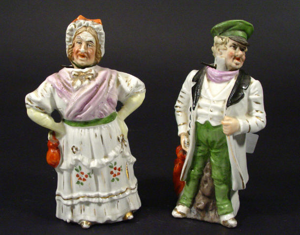 Appraisal: Pair of hand painted Continental porcelain nodding figures - a