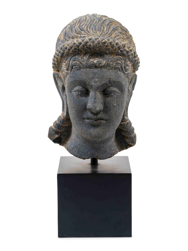 Appraisal: A Life Size Gandharan Grey Schist Head of the Goddess