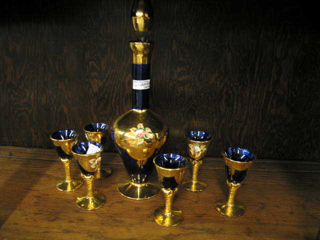 Appraisal: Italian Art Glass Decanter and Cordials gold on cobalt