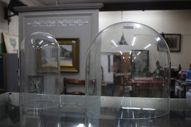 Appraisal: AN OLD GLASS DOME cut down further glass dome and