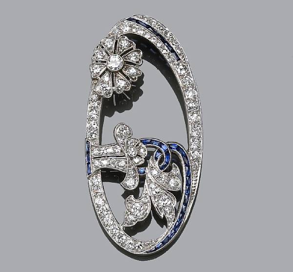 Appraisal: A diamond and sapphire pendant estimated total diamond weight carats