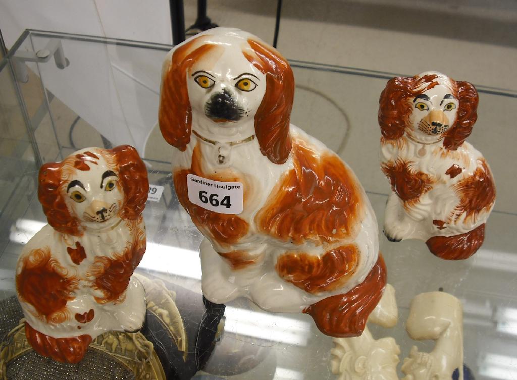 Appraisal: Pair of small Staffordshire seated spaniels with rough coats and