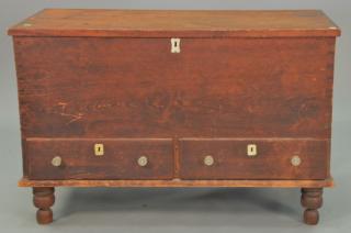 Appraisal: Primitive pine lift top chest over two drawers on turned