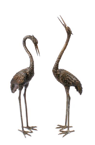 Appraisal: A pair of patinated bronze models of cranes height of