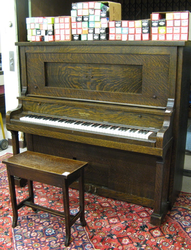 Appraisal: AMERICAN OAK PLAYER PIANO WITH BENCH AND PLAYER ROLLS Farrand