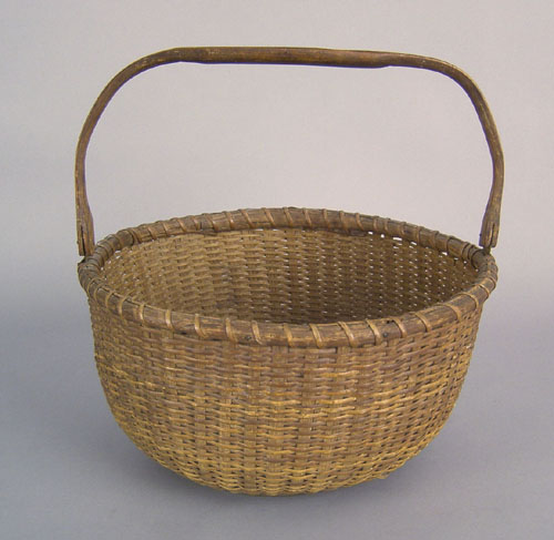 Appraisal: Nantucket basket attributed to Mitchell Ray with swing handle h